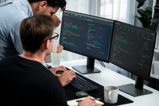 IT developers discussing online software development information on pc screen, creating program coding for latest version application on website. Concept of brainstorming firmware updated. Sellable.