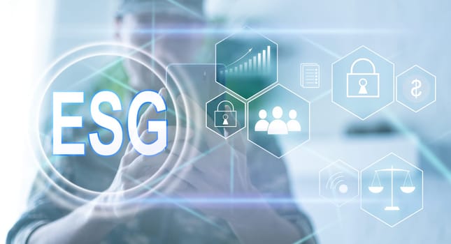 ESG environmental social governance investment business concept. analyze ESG data. icons pop up on virtual screen in business sustainability investment strategy concept.