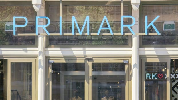 Amsterdam Netherlands 21 April 2024, Primark shopping mall AmsterdamDamrak , a vibrant sign that reads inviting fashion-forward individuals to explore trendy clothing options