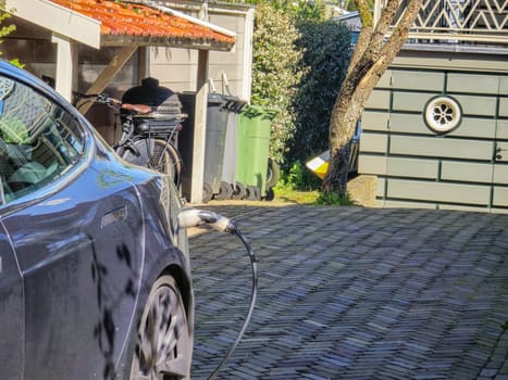 EV charging station for electric car in concept of green energy and eco power produced from sustainable source to supply to charger station in order to reduce CO2 emission