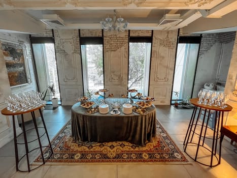 a catering table in a room with an old stylish decor.