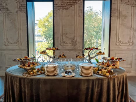 a catering table in a room with an old stylish decor.