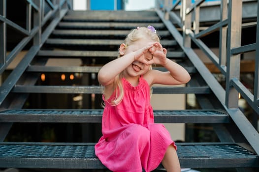 Child with hearing problem and cochlear implant dance in street, deaf kid began to hear. Hearing loss in childhood and treatment concept. Copy space and empty place for text.