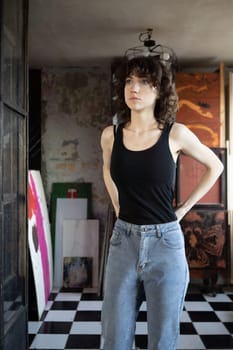 young beautiful woman posing in blue jeans in studio