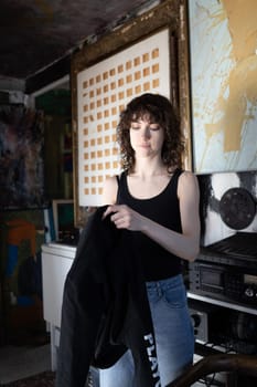 young beautiful woman posing in blue jeans in studio