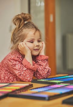 Charming child made makeup with felt-tip pens at home.