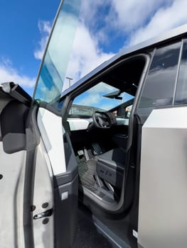 Denver, Colorado, USA-March 28, 2024-The interior shot of the Tesla Cybertruck showcases the roomy rear cabin with its modern, streamlined seats and durable flooring, reflecting the blend of utility and design.