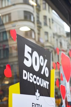 Large red Sale text letters on red background on clothing store