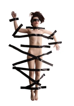 BDSM concept. Image of naked woman tied with duct tape