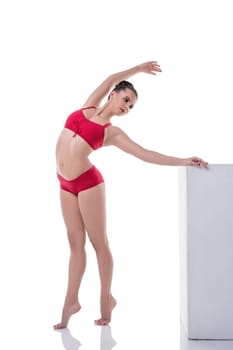 Image of graceful girl training while standing on tiptoe