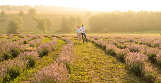 Beautiful couple on the lavender field.