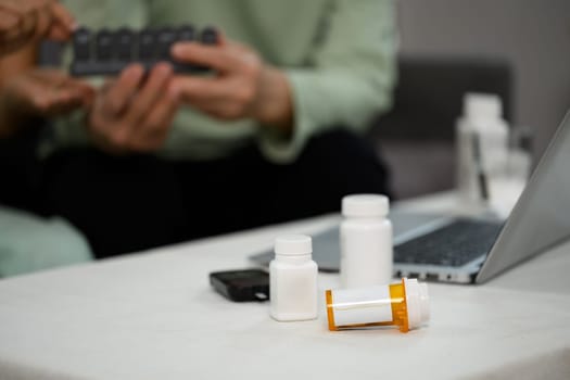 Prescription medicine pill bottles on table. Healthcare and medicine concept.