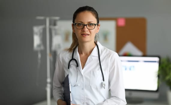 Adult caucasian female doctor against hospital office background portrait, Medical education concept.