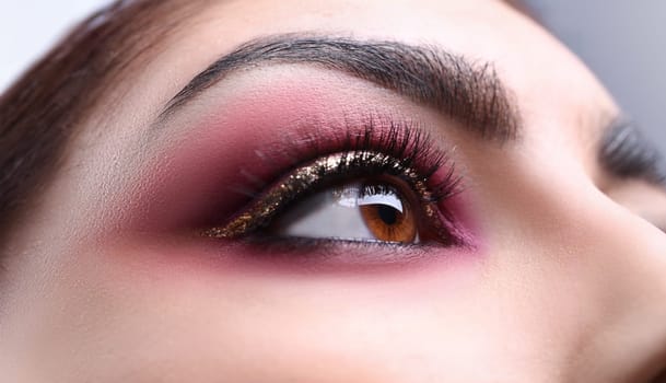 Make-up eye of young attractive woman beauty portrait. Print for showcases of cosmetic stores concept.