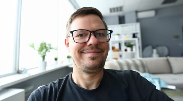 Handsome adult caucasian man make self photo against office background. Happy lifestyle concept