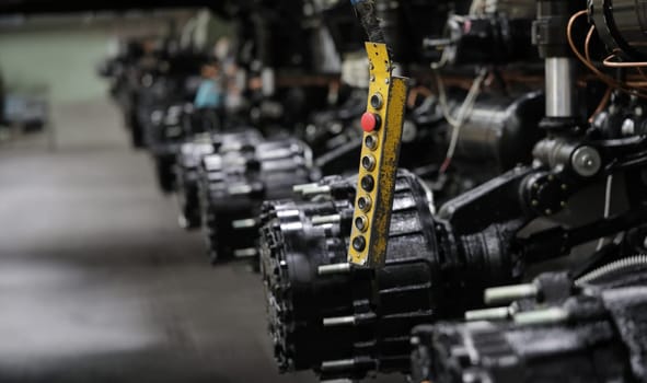 Close-up of lock washers on cross of automobile cardan shaft. Mechanical parts of auto steering system repaired in modern workroom. Car repairing workshop concept