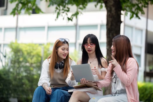 Asian young campus student enjoy learn study and reading books together. Friendship and Education concept. Campus school and university. Happiness and funny of learning in college.