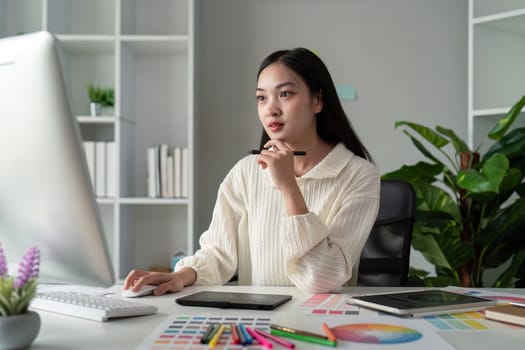 Asian woman graphic designer working in home office. Artist creative designer illustrator graphic skill concept.