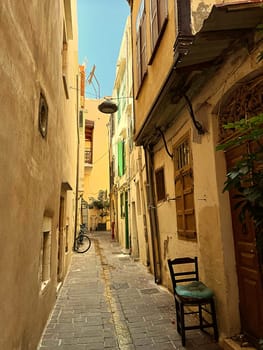 Beautiful old buildings, streets, stairs and alley ways in the town of Chania, Greece at 10 August 2023. High quality photo
