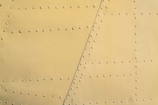 the texture of painted metal with rivets. photo
