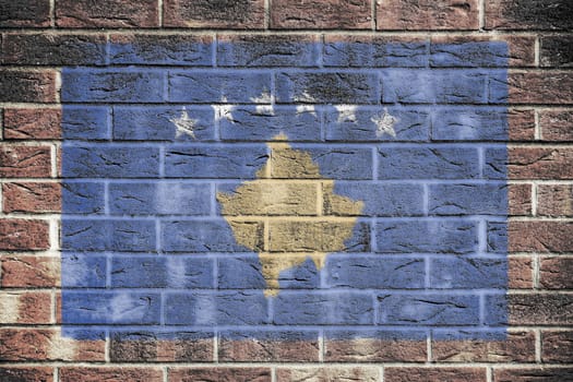 A Kosovo flag on brick wall background white stars gold map