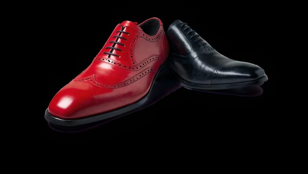 A pair of men's shoes in red and black colors on transparent background