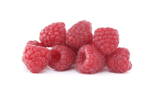 Pile of red ripe raspberry berries isolated on white background, low angle view