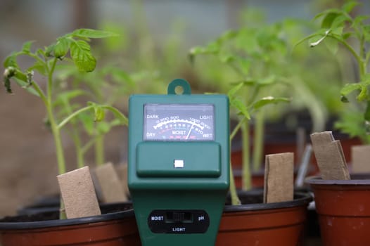Agricultural meter in close up over blurred background. High technology agriculture concept