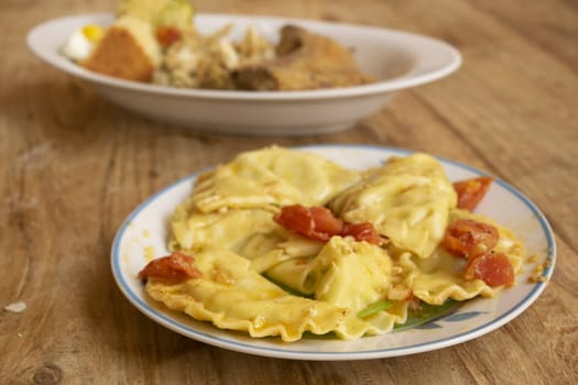 stuffed homemade ravioli with freh tomato sauce