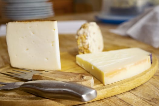 platter of cheese wedges including a walnut cheese