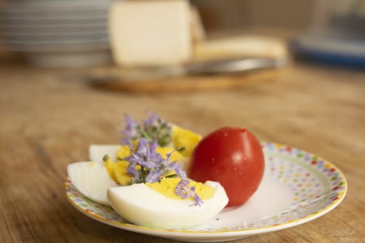 composition of boiled eggs tomatoes and flowers