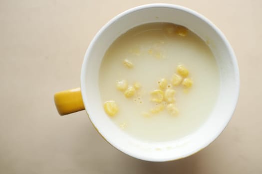 instant cup soup in a mug on table .