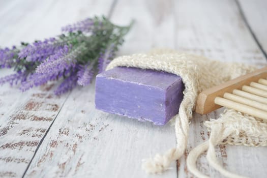 Homemade natural soap bar and lavender flower on table ,