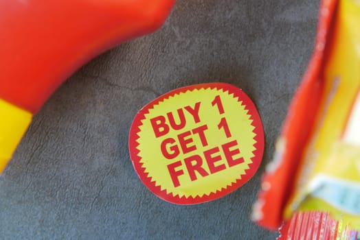 buy 1 get 1 free offer sticker and packers on table .