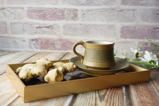 Ginger tea on wooden background