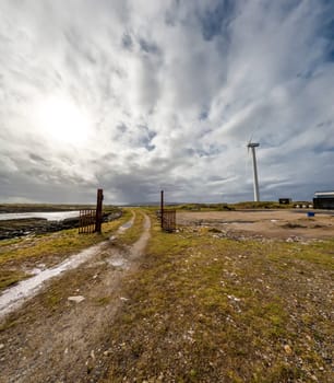 A Wind turbine is generating in Burtonport harbour, Countz Donegal, Ireland.