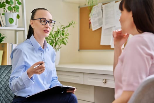 Professional mental psychologist counselor at therapy session with female patient. Talking women sitting in office, psychology, psychotherapy, counseling, health care, support help treatment concept