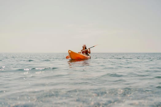 Kayak sea woman. Happy attractive woman with long hair in red swimsuit, swimming on kayak. Summer holiday vacation and travel concept