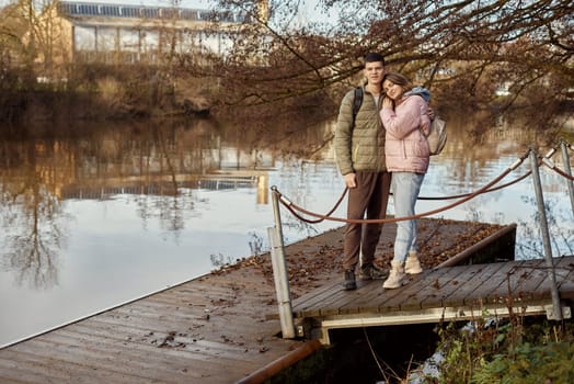 Embracing Moments: Beautiful 35-Year-Old Mother and 17-Year-Old Son in Winter or Autumn Park by Neckar River, Bietigheim-Bissingen, Germany. Celebrate the warmth of family love with this captivating image featuring a beautiful 35-year-old mother and her 17-year-old son embracing in the scenic park by Neckar River in Bietigheim-Bissingen, Germany. Whether touched by winter's chill or adorned with autumn hues, it's a timeless snapshot of familial connection amidst the enchanting surroundings