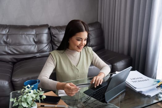 Young woman using credit card and tablet for buying online shopping at home , payment, buying and online shopping concept.