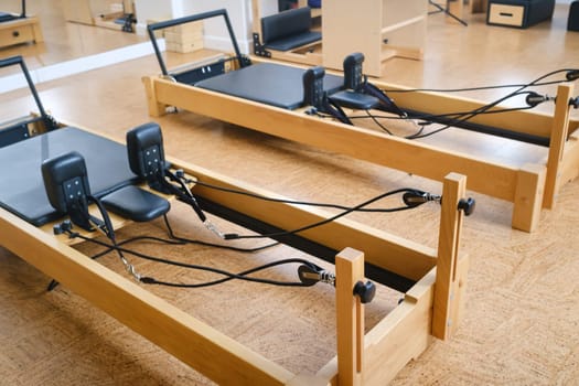 the reformer machine in the pilates room. Yoga equipment.