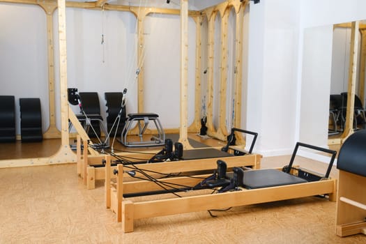 the reformer machine in the pilates room. Yoga equipment.