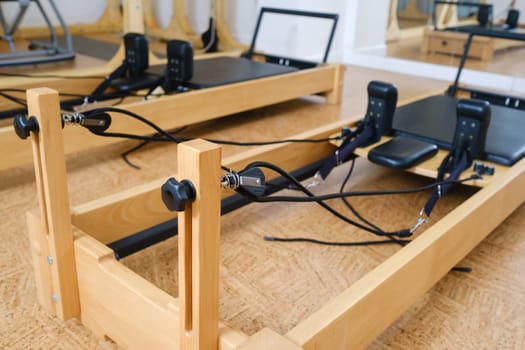 the reformer machine in the pilates room. Yoga equipment.