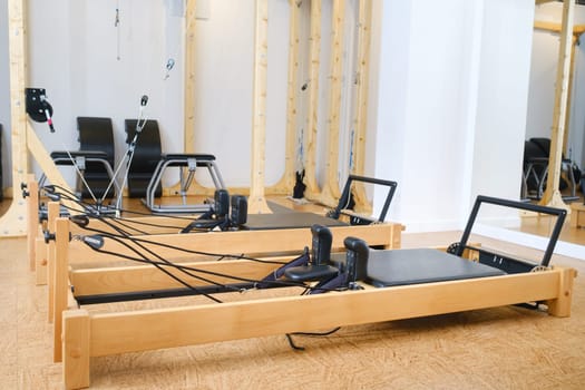 the reformer machine in the pilates room. Yoga equipment.