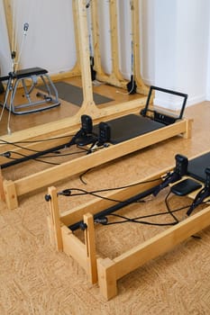 the reformer machine in the pilates room. Yoga equipment.