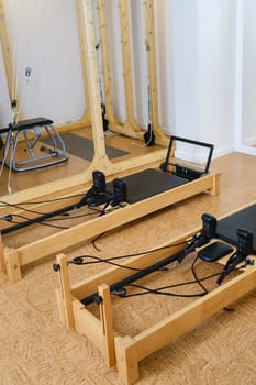the reformer machine in the pilates room. Yoga equipment.