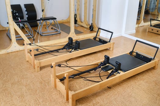 the reformer machine in the pilates room. Yoga equipment.