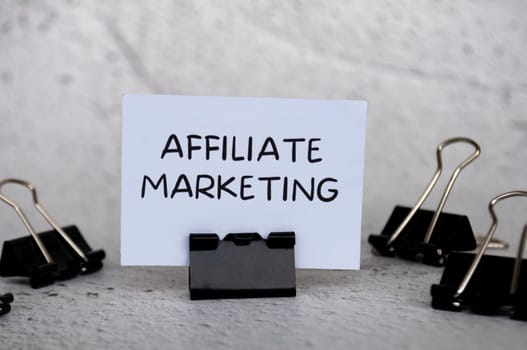 Affiliate marketing text on standing white paper.