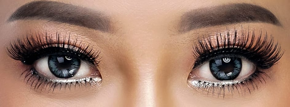 Close up image of healthy human woman eye with women eyelashes for multimedia content