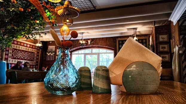 A close-up of a table with decorative items in a warmly lit cafe